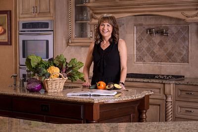 Angel Bowie in a kitchen with fresh produce